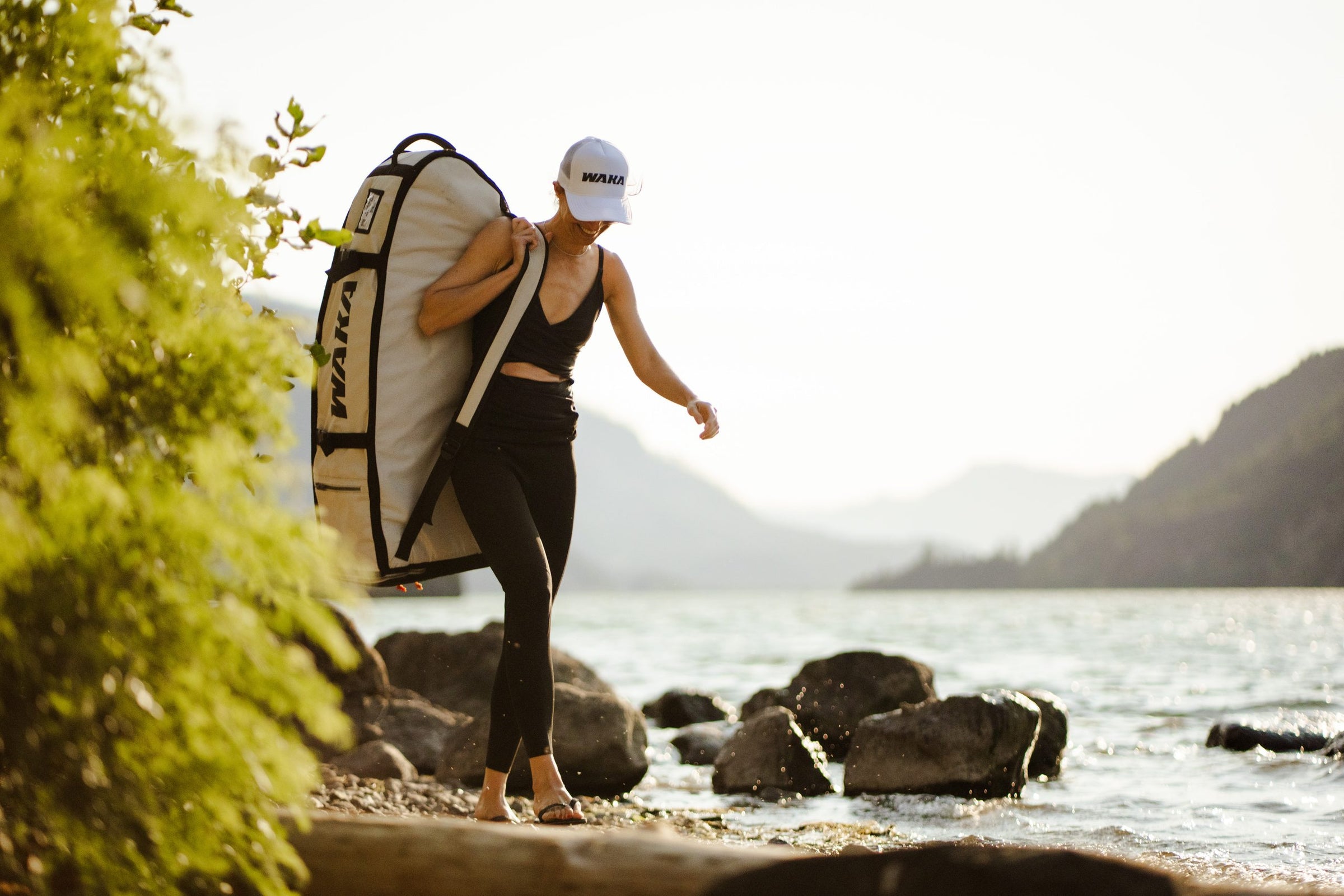 Rider carrying a WAKA board bag over the shoulder