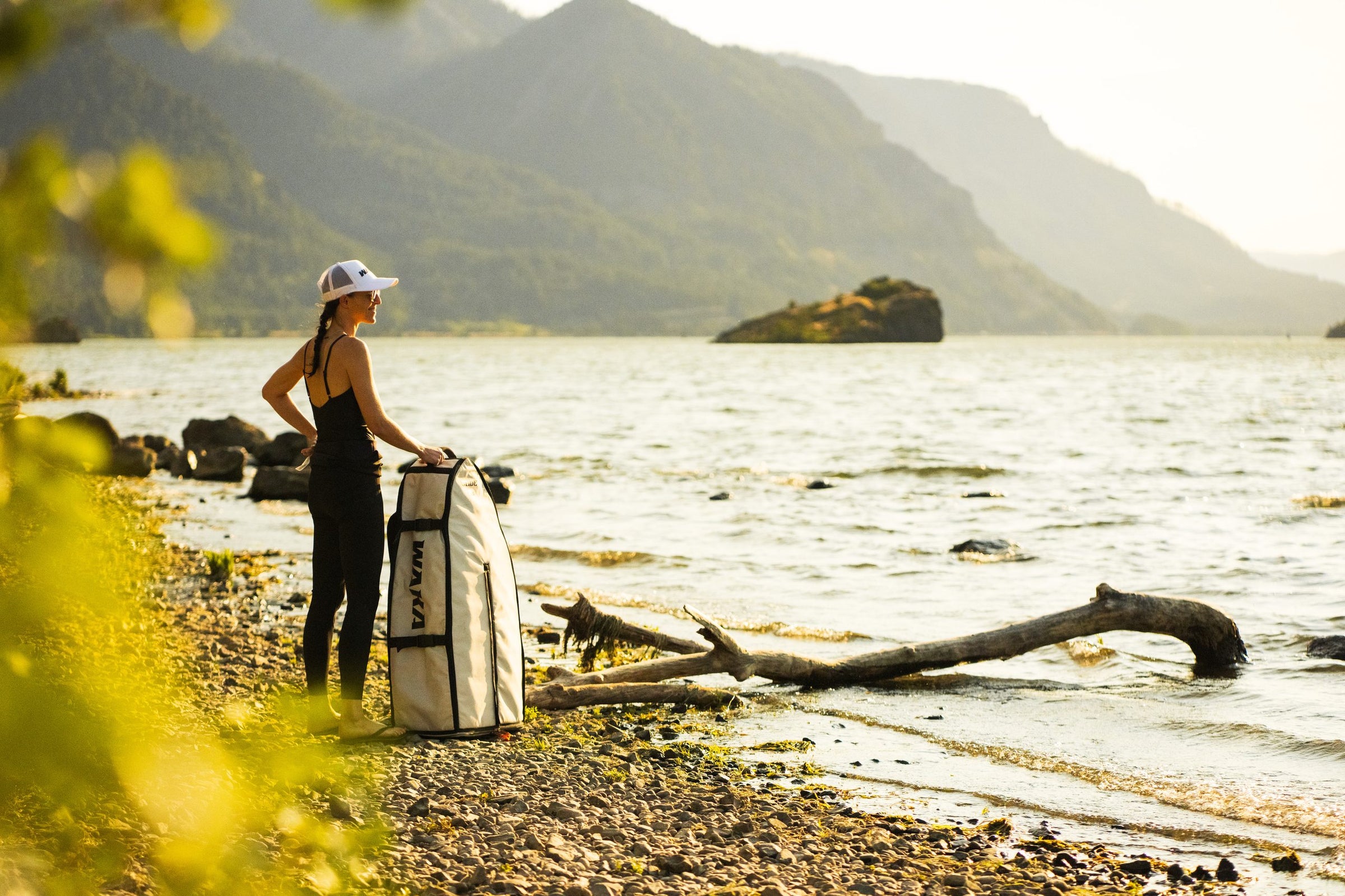 Rider with a WAKA board bag on the shore